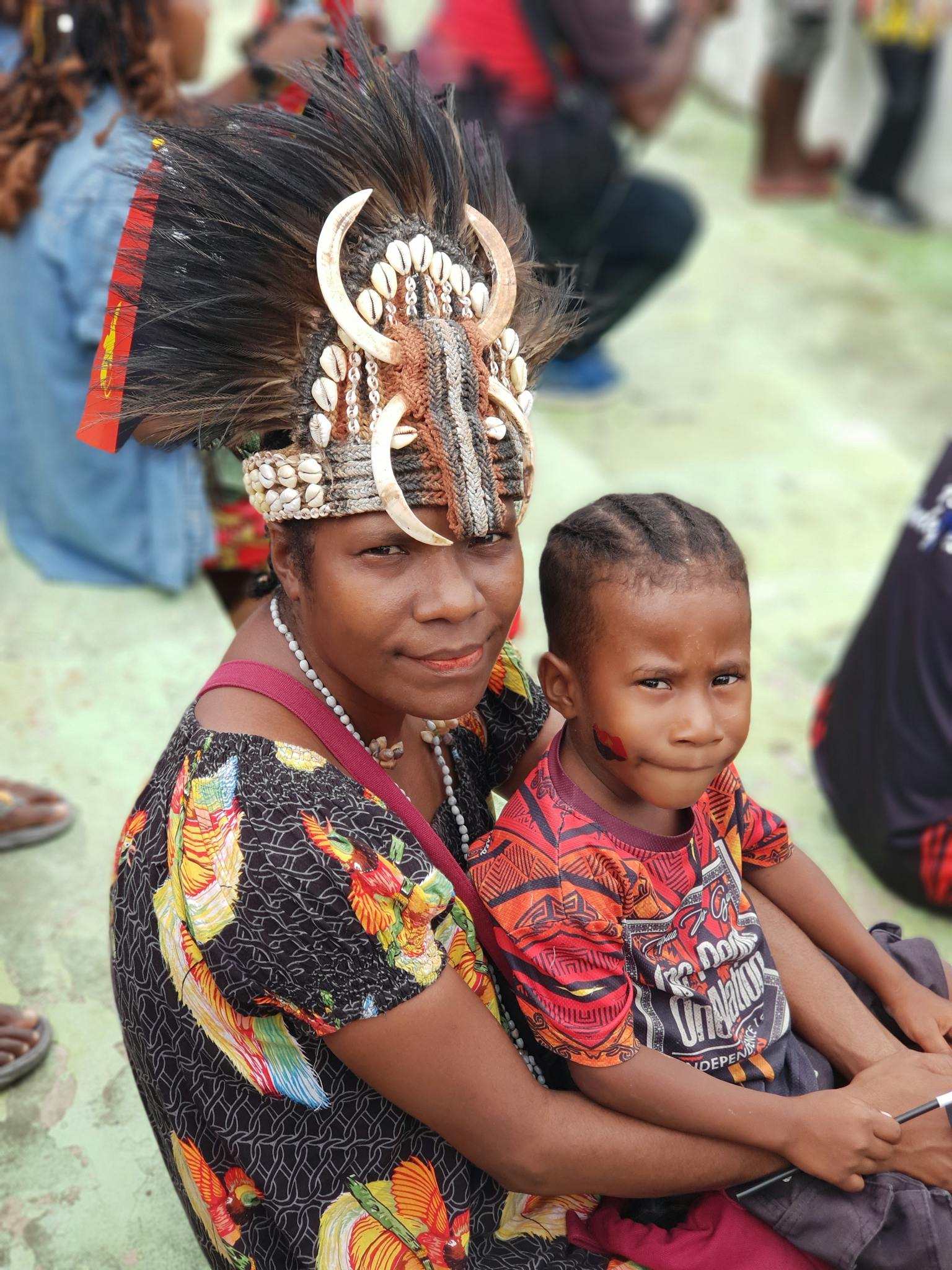 A woman and child in traditional attire during a cultural celebration in Wewak, Papua New Guinea.