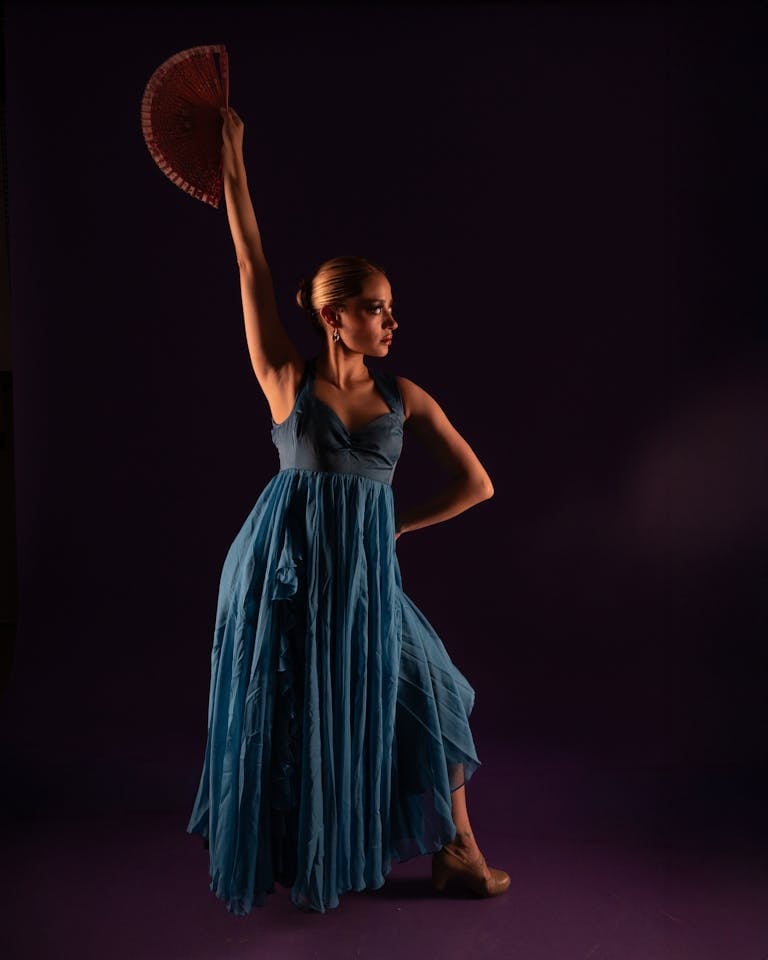 Elegant female flamenco dancer in a dramatic pose, exuding grace and emotion.